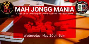 A close-up of hands playing mahjong with red and white tiles on a table. Text promotes "Mah Jongg Mania," a fundraising event for the Vienna Volunteer Fire Department on Wednesday, May 20th, 6pm.
